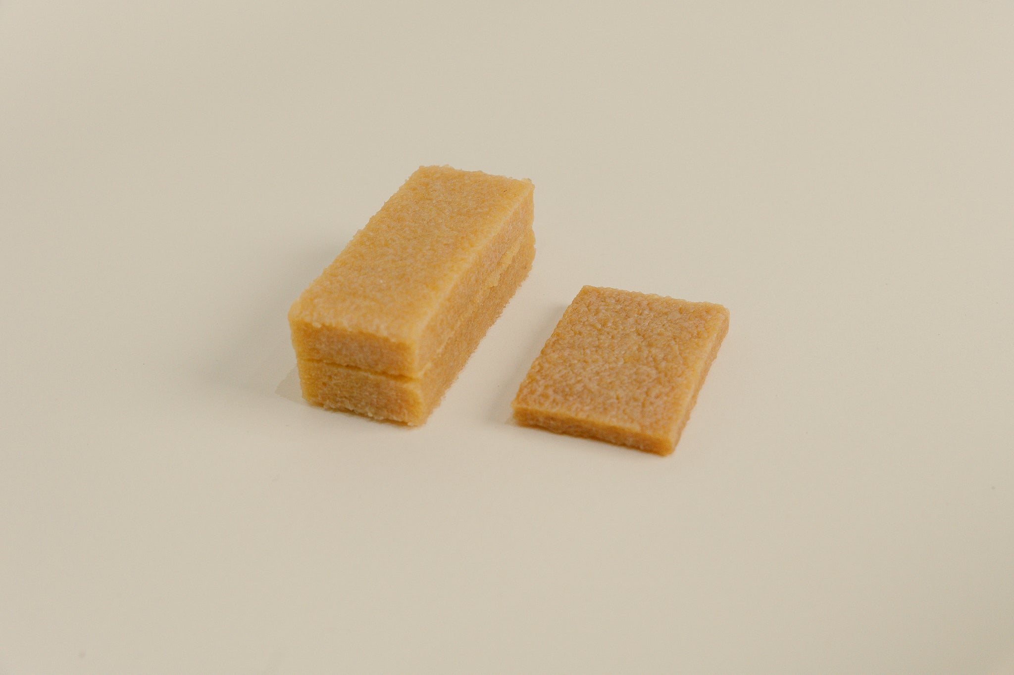 Brillaré Magic Brick suede eraser, nubuck cleaner, sneaker cleaner, sole edge cleaner, and suede care product close up size comparison between standard and XL 