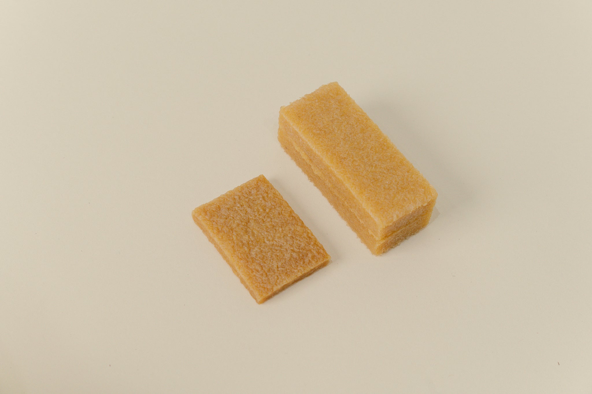 Brillaré Magic Brick suede eraser, nubuck cleaner, sneaker cleaner, sole edge cleaner, and suede care product close up size comparison between standard and XL  2