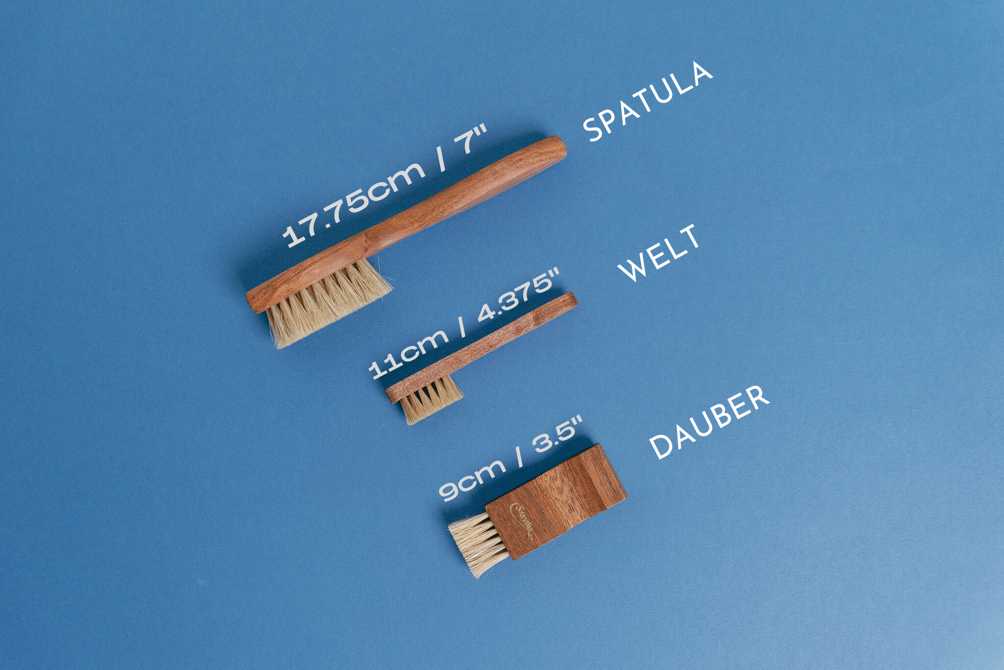 Saphir Medaille d'Or Wood Spatula Horse Hair Shoe Brush displayed with saphir medaille d'or mini spatula / welt brush and saphir medaille d'or dauber applicator brush - Brillare